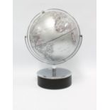 Contemporary table globe with chrome gimbal and circular ebonised base, 36cm high overall