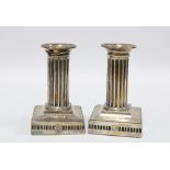 Pair of Victorian silver dwarf candlesticks, Hawksworth, Eyre & Co, Sheffield 1885, with fluted