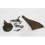 A group of antique firearm parts and accessories to include flintlock action parts, a leather