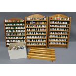 A large collection of thimbles together with four wooden display shelves (a lot)