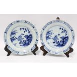 Pair of blue and white delft plates with chinoiserie pattern, 23cm diameter (fritting and light