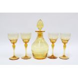 Early 20th century amber glass decanter with stopper and set of four glasses (5) 17cm.