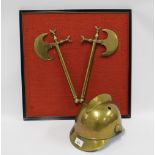 Fireman's brass helmet together with a framed pair of brass axes. (2)