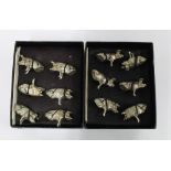 Set of twelve white metal novelty Pig menu card holders, 2cm high, (12)