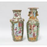 Two Chinese canton famille rose vases, each typically decorated with panels of figures, birds and