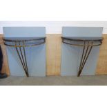 A pair of contemporary consol tables with black marble demi lune tops on bronze open bases . 84 x 80