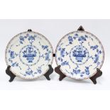 Pair of delft blue and white plates with basket of flowers pattern and brown edge rim, (a/f) 22cm
