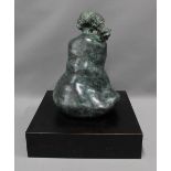 A contemporary bronze sculpture in the form of a bell, with a plumed top, the bronze with a green