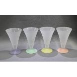 Set of four opaque glasses with harlequin coloured footrims (4)