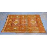 Mid 20th century Moroccan rug, orange field with three medallions and star motifs, , 243 x 137cm
