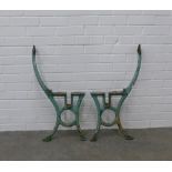 Pair of cast iron bench ends, painted green. 78 x 40cm. (2)