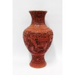 Large Chinese cinnabar baluster vase, carved in high relief with reserves of scholars and other