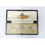 Edwardian 9ct gold ruby brooch, Birmingham 1905, cased set of three mother of pearl and sapphire