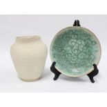Habitat biscuit glazed studio pottery vase and a studio pottery shallow dish with swirled green