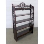 Mahogany waterfall bookcase with pierced sides and top. 144 x 92 x 42cm.