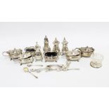 A collection of ten silver cruets and a silver mounted glass salt with a quantity of condiment