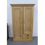 Pine wardrobe with projecting cornice over one long and one short door, internal hanging rail and