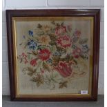 Late19th / early 20th century embroidered panel, framed under glass within a faux rosewood frame,