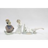 Two Lladro figures, together with a Lladro goose and Nao geese, tallest 17cm (4)