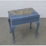 Blue painted piano stool, with an upholstered lift up top in a floral bird fabric, on cabriole legs,