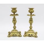 Pair of ornate brass candlesticks, with mask heads and pierced bases, 20cm (2)