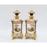 Pair of continental square form vases with covers, with pierced rim and paw feet, 23cm (2)