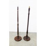 Two mahogany standard lamps. 148cm. (2)