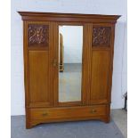 Mahogany wardrobe, projecting cornice over a mirrored door with internal hanging rail, flanked by
