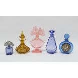 Five coloured glass scent bottles, including one with Lalique style figural stopper, 18cm (5)