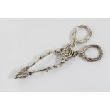 A pair of Victorian cast silver scissor tongs, London 1848