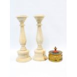 Pair of wooden whitewashed baluster candlesticks, 42cm, together with a painted wooden pot and cover