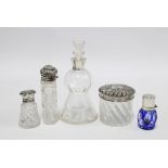 A group of four silver mounted glass scent bottles to include a thistle shaped bottle with