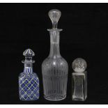 A group of three 20th century glass scent bottles, one with gilt lettering, tallest 22cm (3)