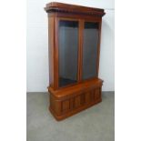 Victorian mahogany bookcase cabinet of tall proportions, projecting egg and dart cornice above a