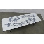 Retro coffee table, the rectangular top with stylised grey leaf pattern, with an undertier and