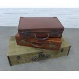 Three vintage suitcases, two leather and one canvas, largest 19 x 82 x 41cm and a washboard, (4)