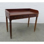 Victorian mahogany writing table with a three quarter gallery and two frieze drawers, ring turned