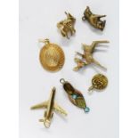 18ct gold hat charm, three 9ct gold charms to include an aeroplane, deer with gemset eyes and a