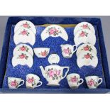 Child's vintage tea set with a floral rose pattern, in original box