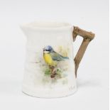 A small Royal Worcester cream jug of barrel form handpainted bluetit pattern & signed Powell,