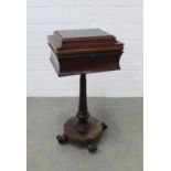 19th century rosewood teapoy, the sarcophagus top with a hinged lid opening to reveal caddy
