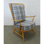 An Ercol blonde elm high back open armchair with grey tartan cushions 104 x 73 x 65cm.