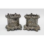 A pair of silver plated wine coasters, pierced design with cast fruit and vine borders, 10.5cm high,