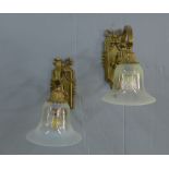 A pair of brass wall lights with vaseline glass shades (one shade with a small rim edge chip) (2) 27