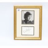 Bob Dylan autograph on white card and signed in black ink mounted with a black and white