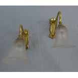 A pair of Art Nouveau style brass wall lights with opaque glass shades (2)