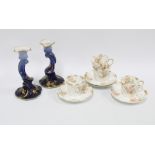 Limoges porcelain cups and saucers and a pair of blue glazed candlesticks (a lot)