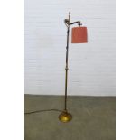 Early 20th century adjustable brass standard lamp with shade. 150cm.