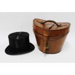 Henry Heath black silk top hat together with a brown leather top hat box (2) 20cm.