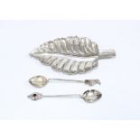Mexican silver leaf dish, 14.5cm and two white metal teaspoons, (3)